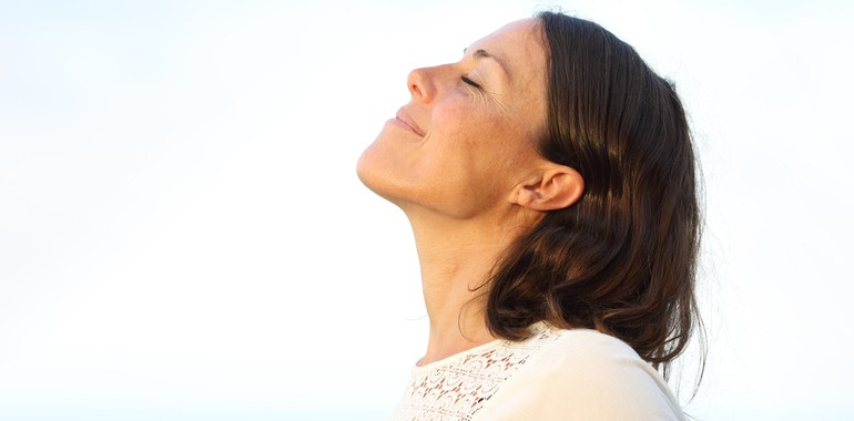 Adult woman breathing fresh air